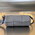 BOTTEGA VENETA SMALL CYLINDER CASSETTE 21 IN LAVA GRAY CALFSKIN