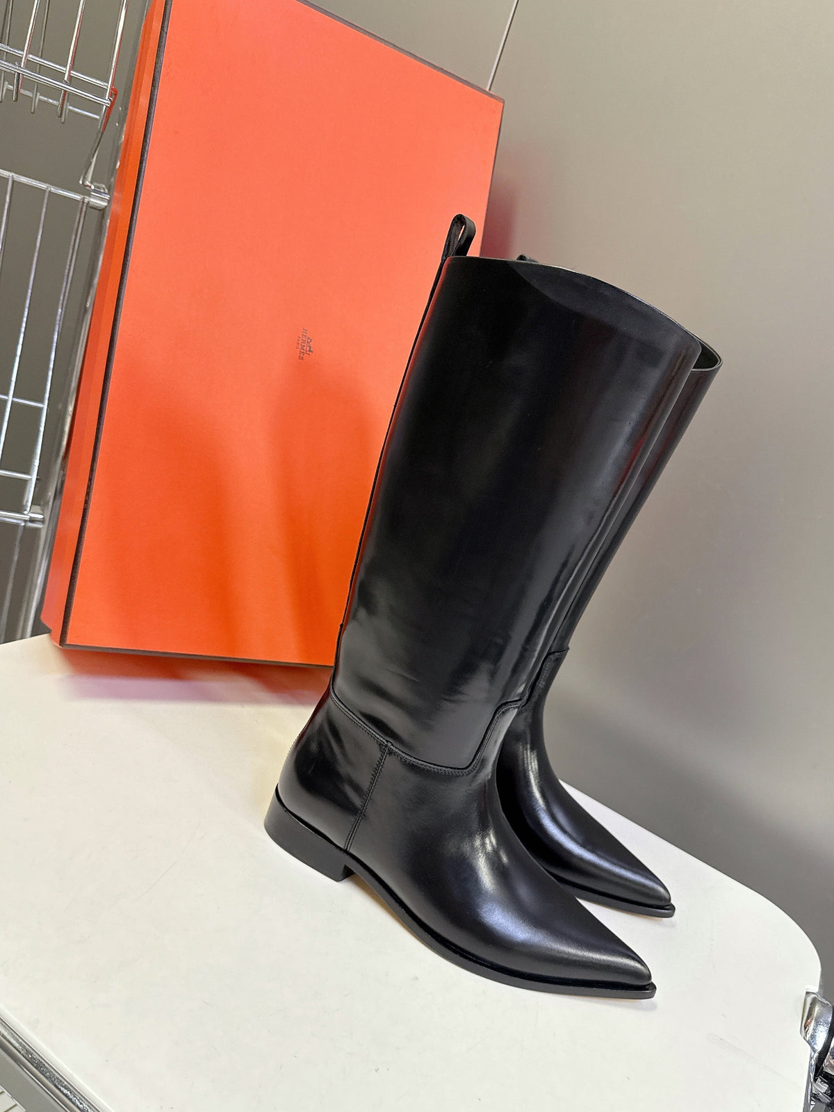 HERMES 25S POINTED-TOE KNEE-HIGH BOOTS IN BLACK GLOSSY LAMBSKIN