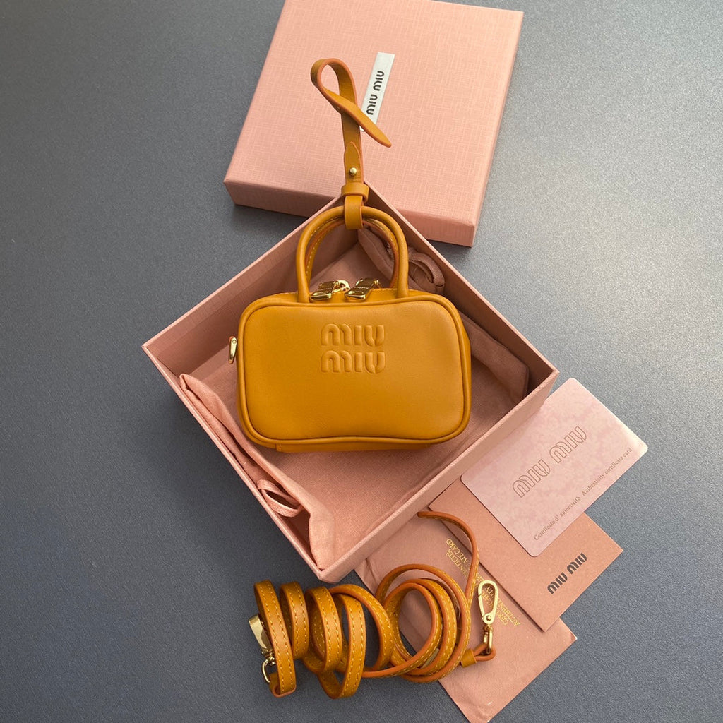 MICRO BAG KEYCHAIN 11 IN INDOCHINE ORANGE CALFSKIN EMBOSSED LOGO